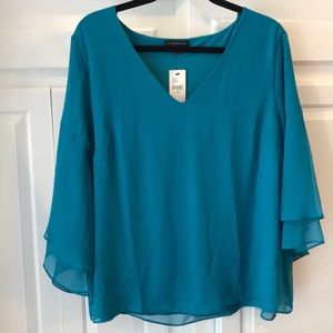 Women’s blue flowy blouse